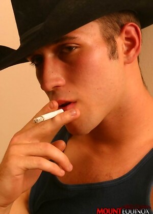 Cute twink in cowboy outfit who loves a nice smoke after sex