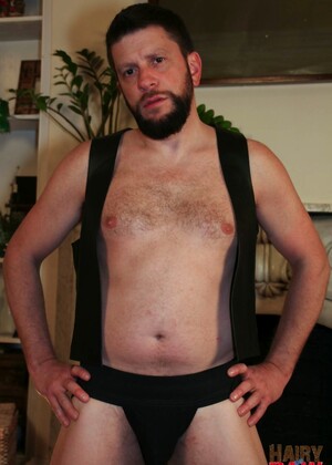 Dark haired gay Randy Scott wanking off his dick