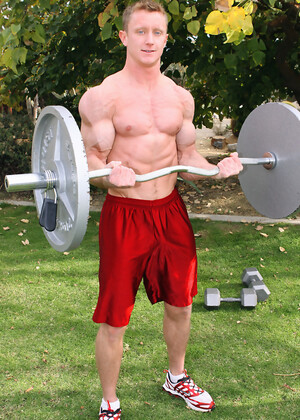 Clark working out and strokes his muscle cock