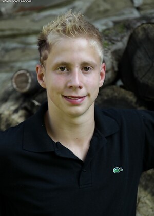 Twink Davis tugs on his uncut dick outdoors.
