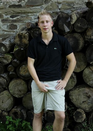 Twink Davis tugs on his uncut dick outdoors.
