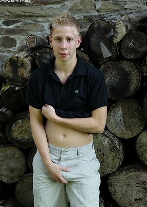 Twink Davis tugs on his uncut dick outdoors.
