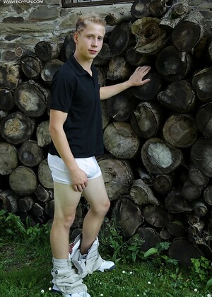 Twink Davis tugs on his uncut dick outdoors.
