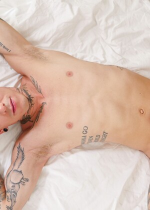 Sexy tatttooed twink Roman Capellini shows his ass