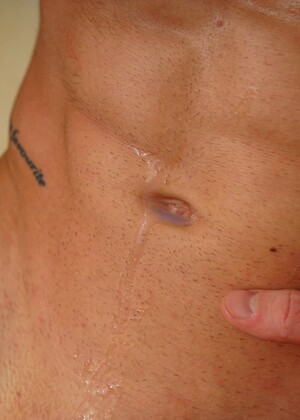 Tattooed uncut athlete Martin Spell jacking off his dick