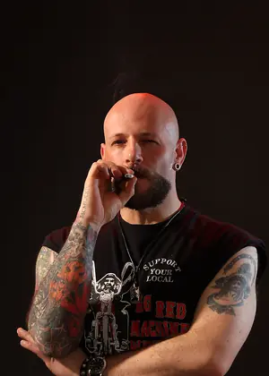 Tattooed Biker Smoking - Mike Chain by Butch Dixon
