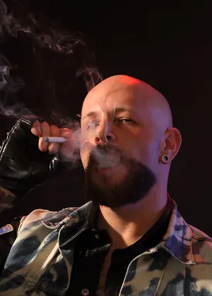 Tattooed Biker Smoking - Mike Chain by Butch Dixon
