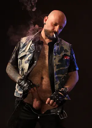 Tattooed Biker Smoking - Mike Chain by Butch Dixon